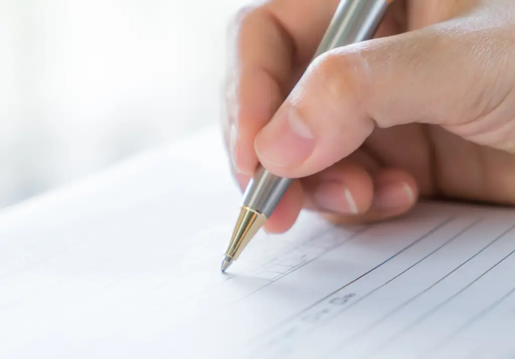 Adult completing a structured psychological assessment during an autism evaluation