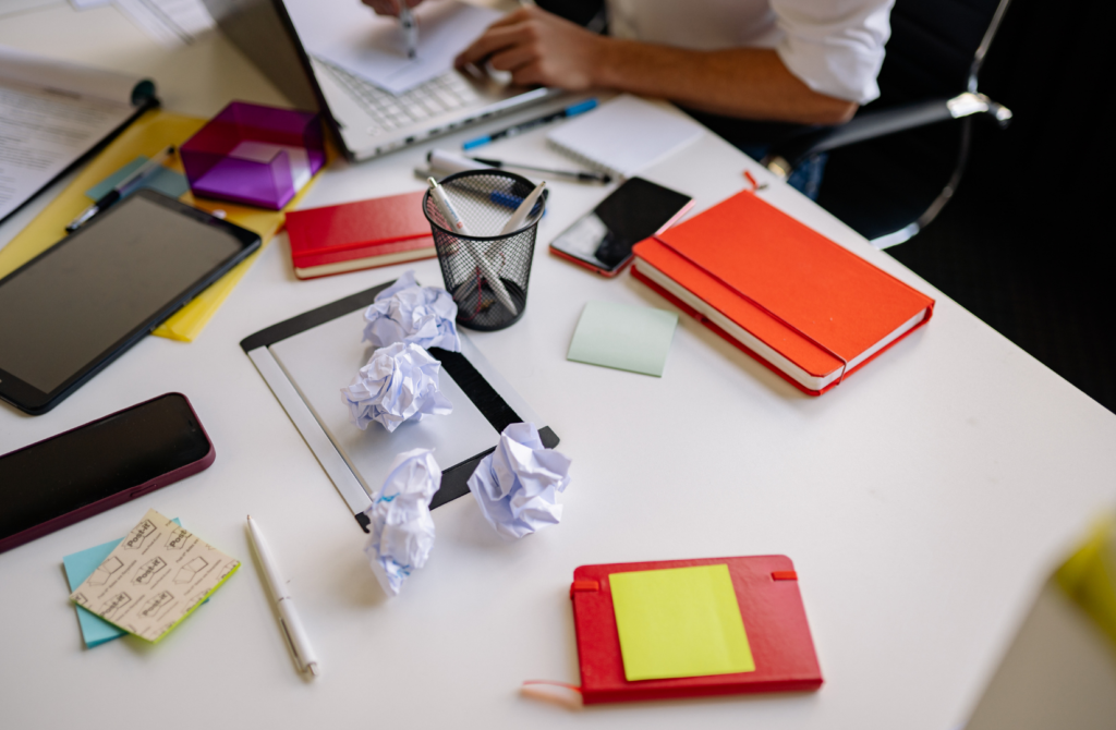Cluttered workspace representing mental clutter and cognitive overload
