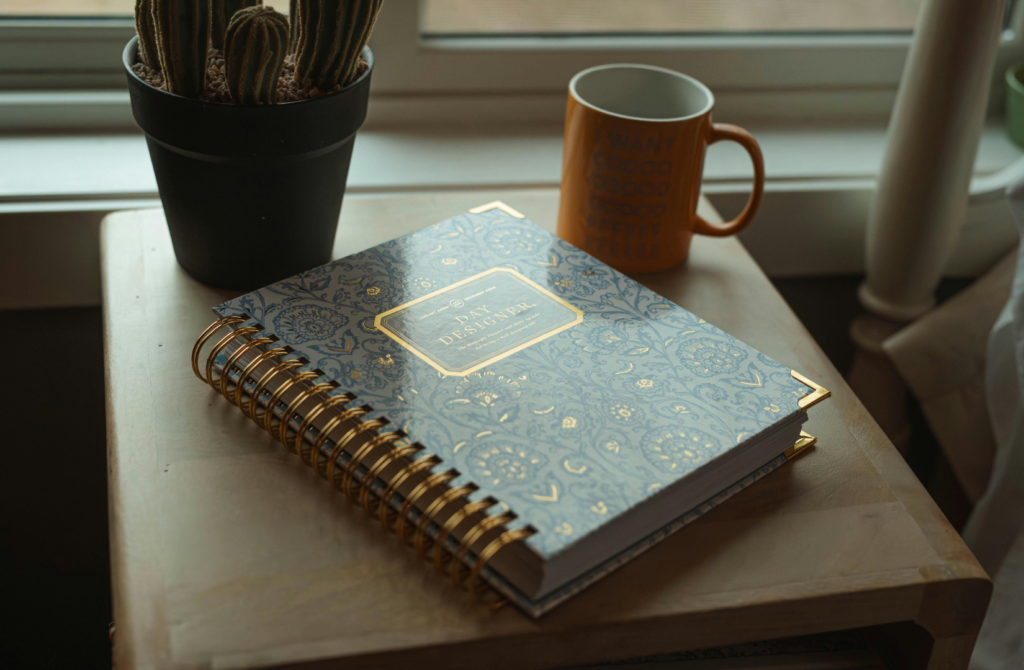 Person journaling to organize thoughts and declutter the mind