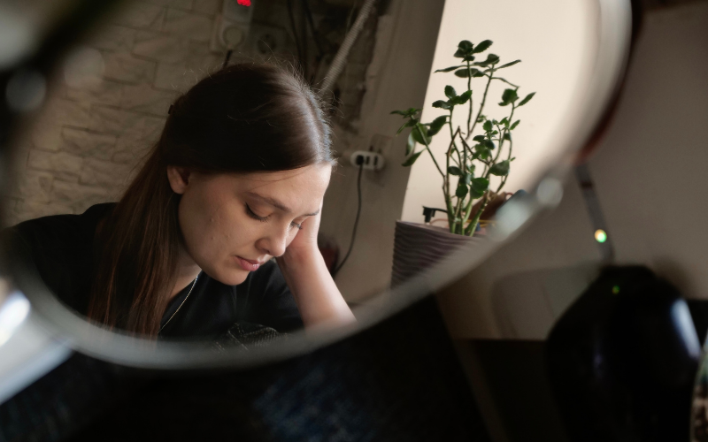 Woman practicing self-compassion and self-reflection during healing process