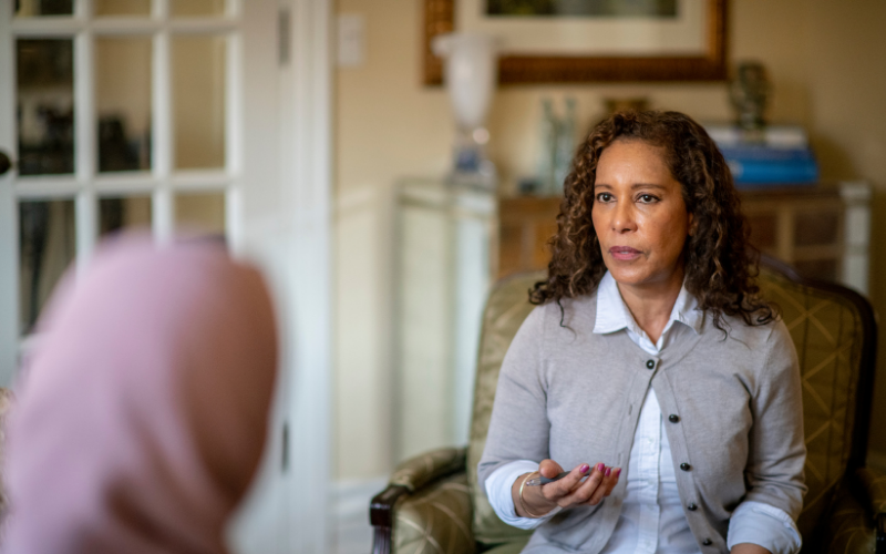 Woman in therapy session with a counselor in a comfortable Utah office setting
