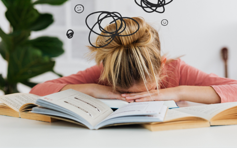 Overwhelmed woman with head down showing frustration when healing isn't linear in therapy