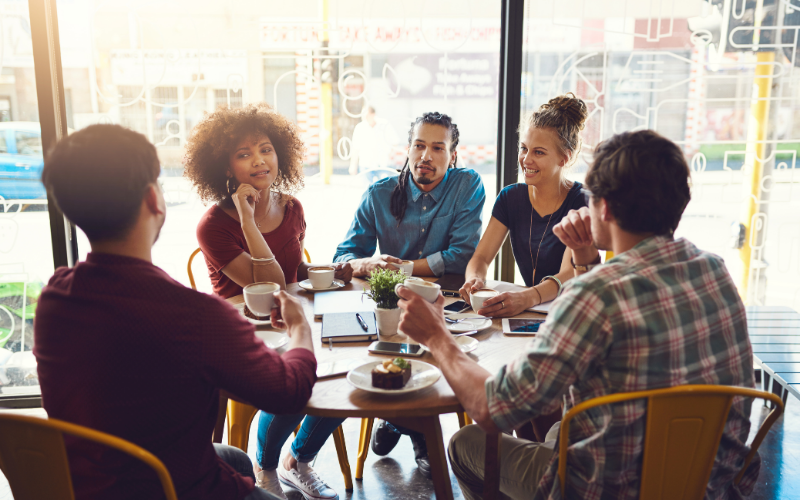 A diverse group in therapy session discussing mental health and personal growth together