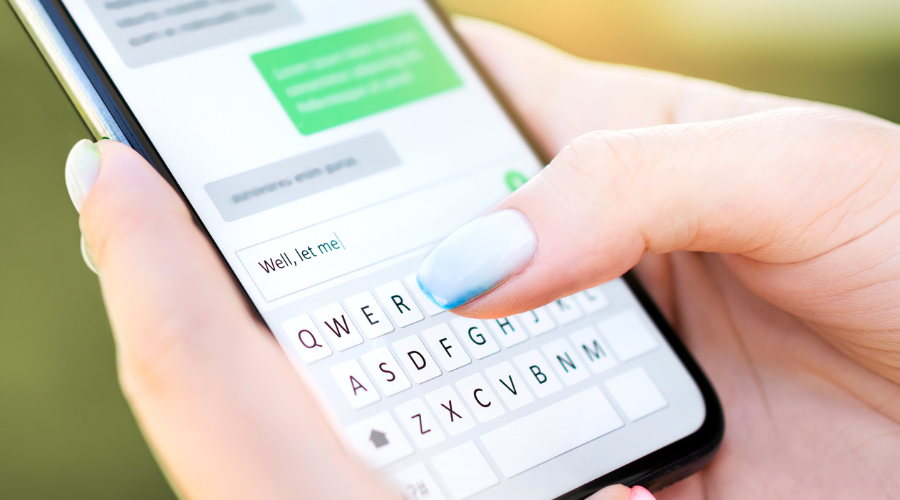 Close up of a phone that people are texting off of.