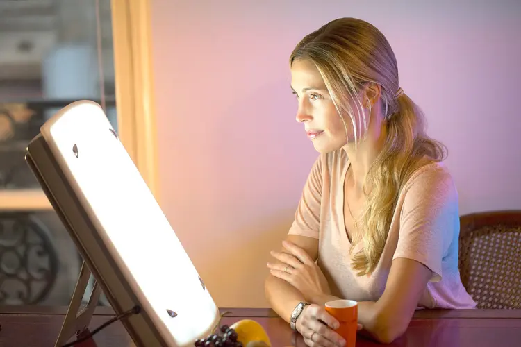 A  woman doing light therapy