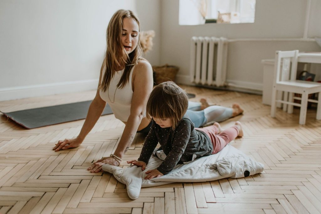 Parent and child practicing relaxation techniques together